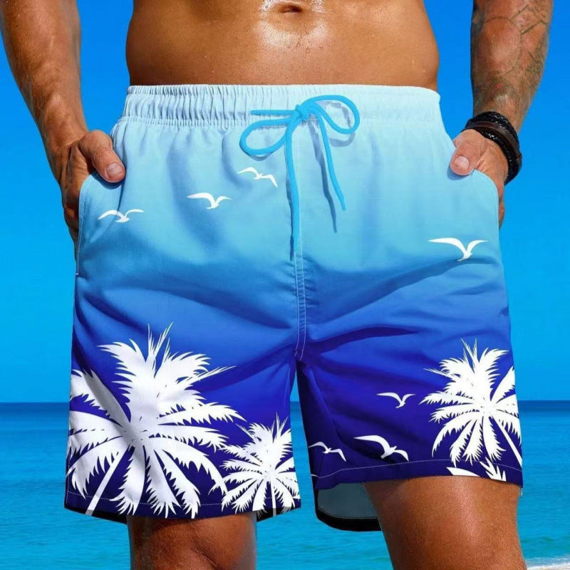 Męskie niebieskie szorty kąpielowe z motywem palm i plaży