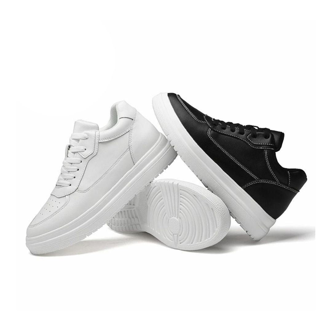 Męskie białe i czarne sneakersy podwyższane ustawione obok siebie