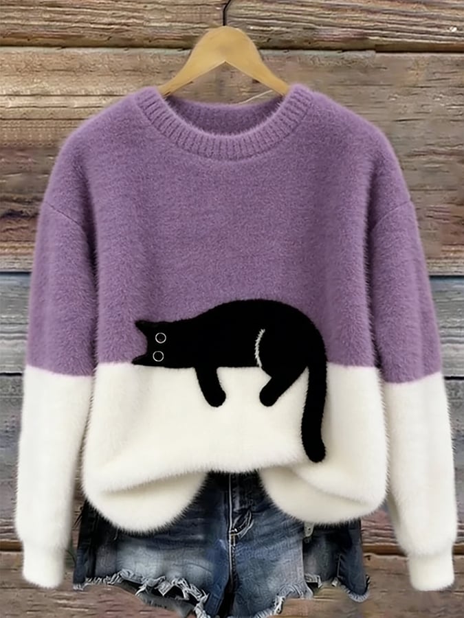 Damski sweter oversize z kotem, prezentacja stylizacji casualowej