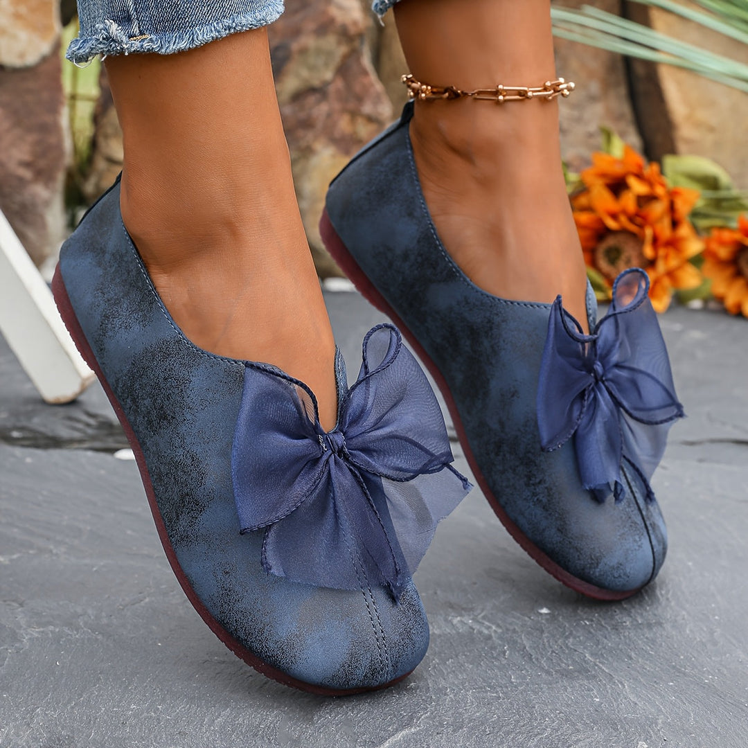 Damskie baletki slip-on z elegancką kokardą, widok z boku