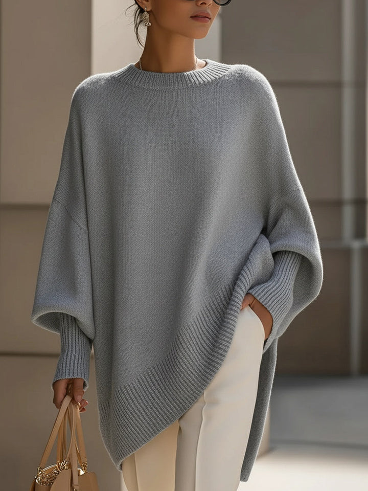 Modny sweter damski w stylu ponczo oversize o asymetrycznym kroju