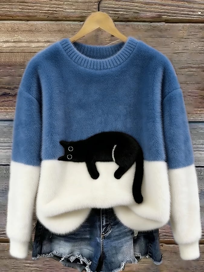 Modny sweter damski z kotem oversize, zbliżenie na wysokiej jakości splot