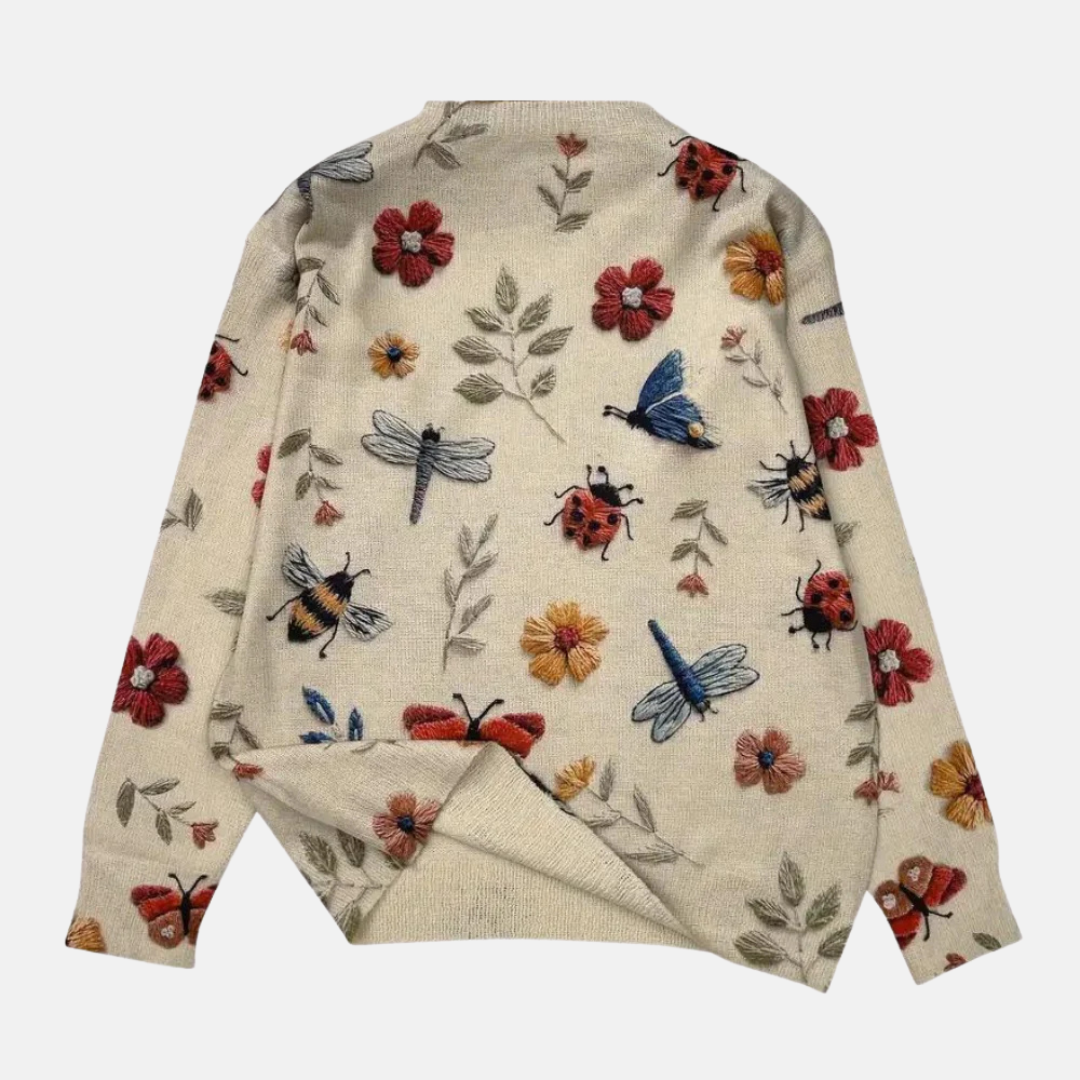 Elegancki sweter damski z okrągłym dekoltem, zbliżenie na haftowane kwiaty 3D