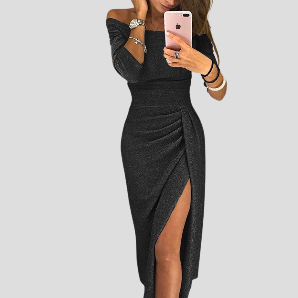 Kobieta w czarnej eleganckiej sukience midi z rozporkiem