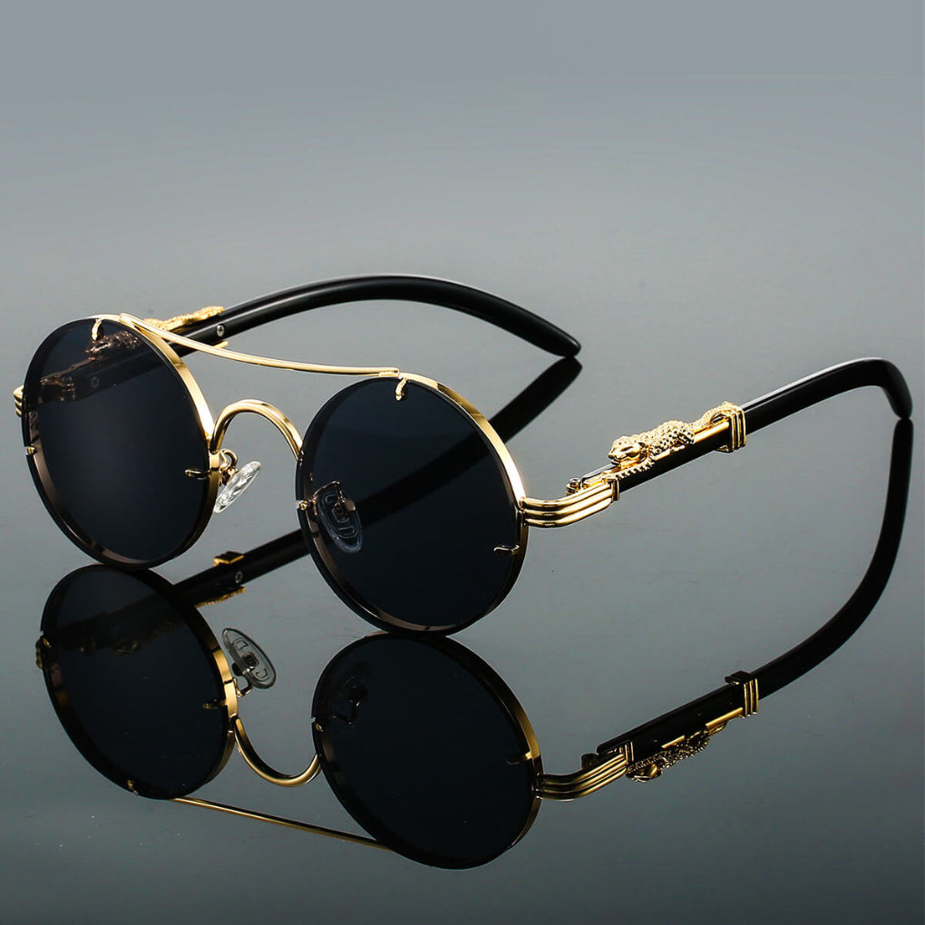 Czarne okrągłe okulary przeciwsłoneczne w stylu retro z metalowymi oprawkami
