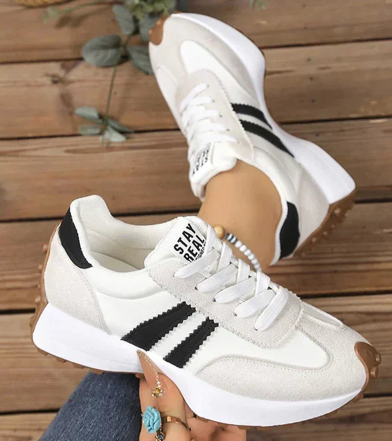 Białe damskie sneakersy Élodiane z czarnymi akcentami