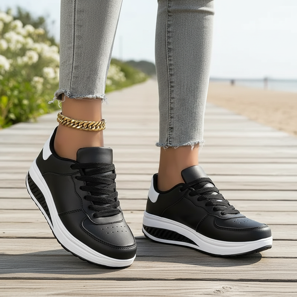 Damskie sneakersy ortopedyczne w kolorze czarnym na tle deptaka