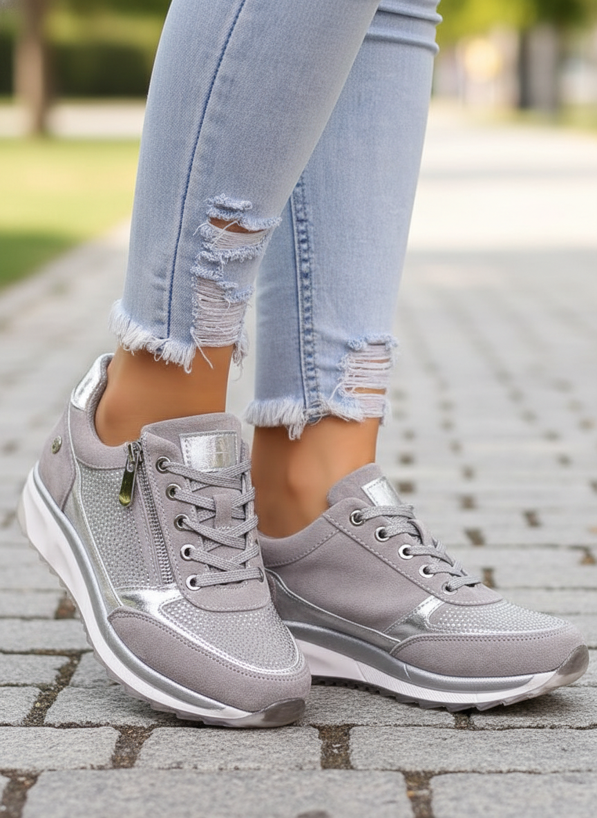 Damskie szare sneakersy ortopedyczne Gabriele na stopach w niebieskich dżinsach