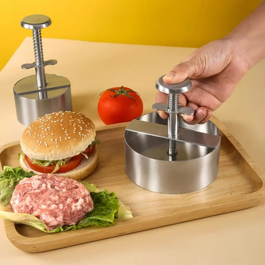 Manualna prasa do burgerów ze stali nierdzewnej obok gotowego burgera
