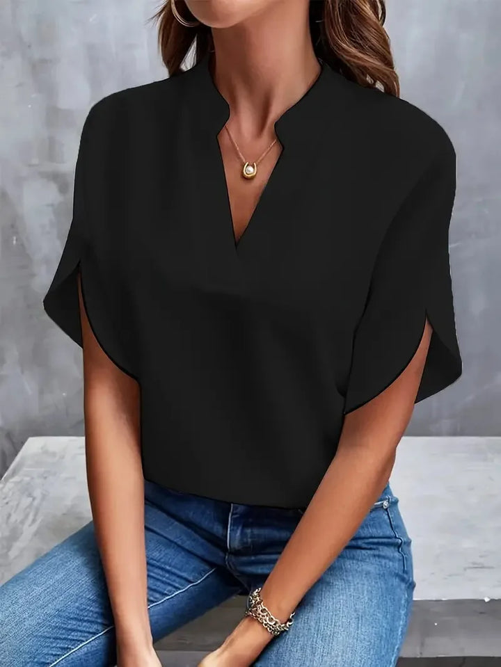 Elegancka bluzka damska z dekoltem w serek w stylizacji biurowej