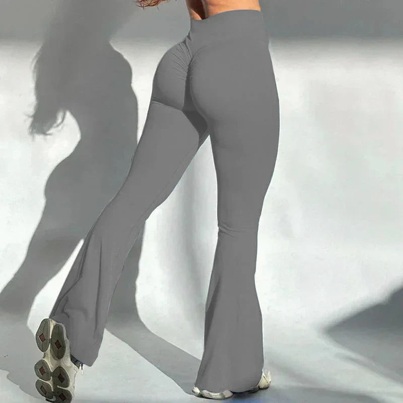 Widok z boku na szare legginsy modelujące pośladki z szerokimi nogawkami
