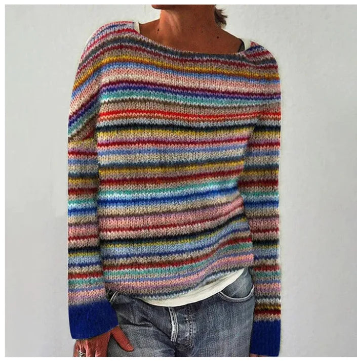 Odzież damska zimowa, elegancki sweter skandynawski na wieszaku