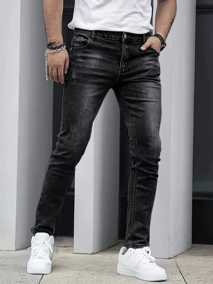 Męskie dopasowane jeansy skinny w kolorze czarnym z przetarciami na sylwetce