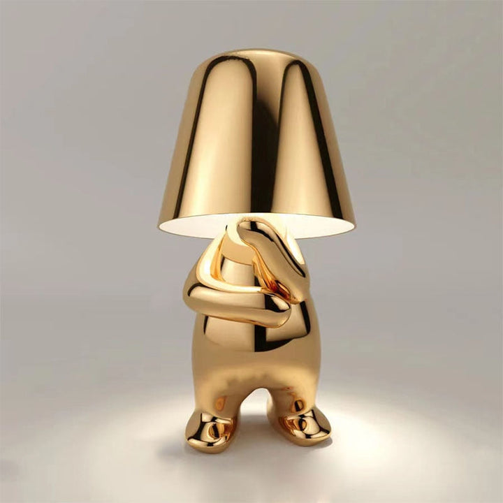 Złota lampa stołowa LED w aranżacji nowoczesnego salonu