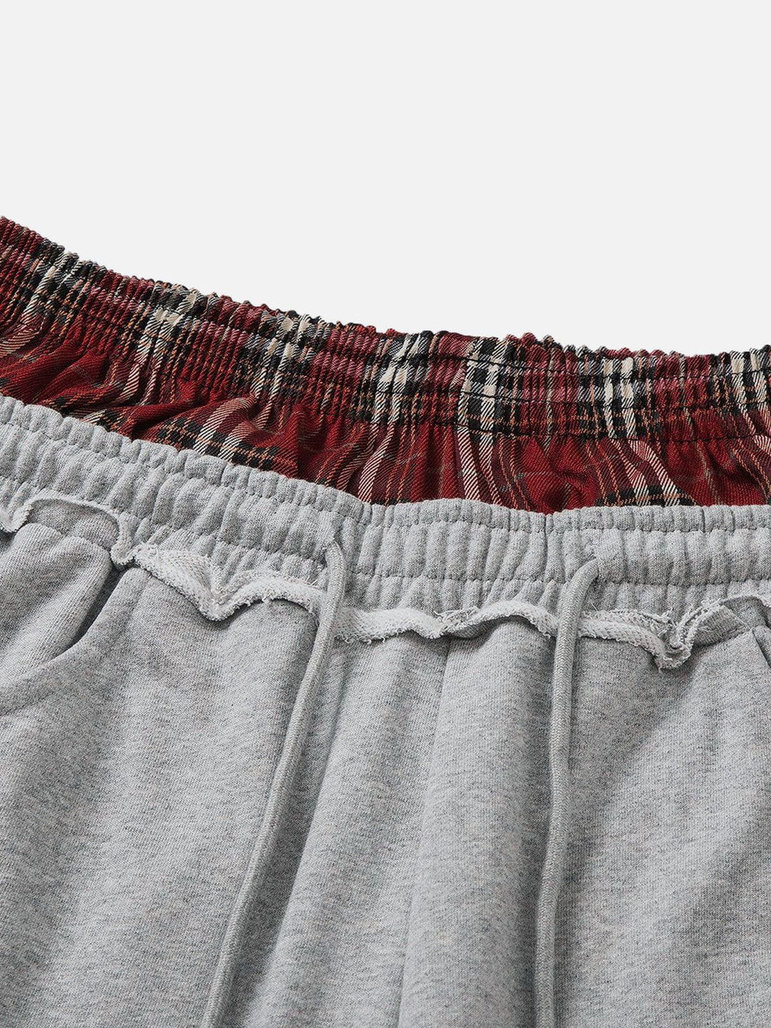 Luźne spodnie dresowe retro w stonowanym kolorze, widok całościowy