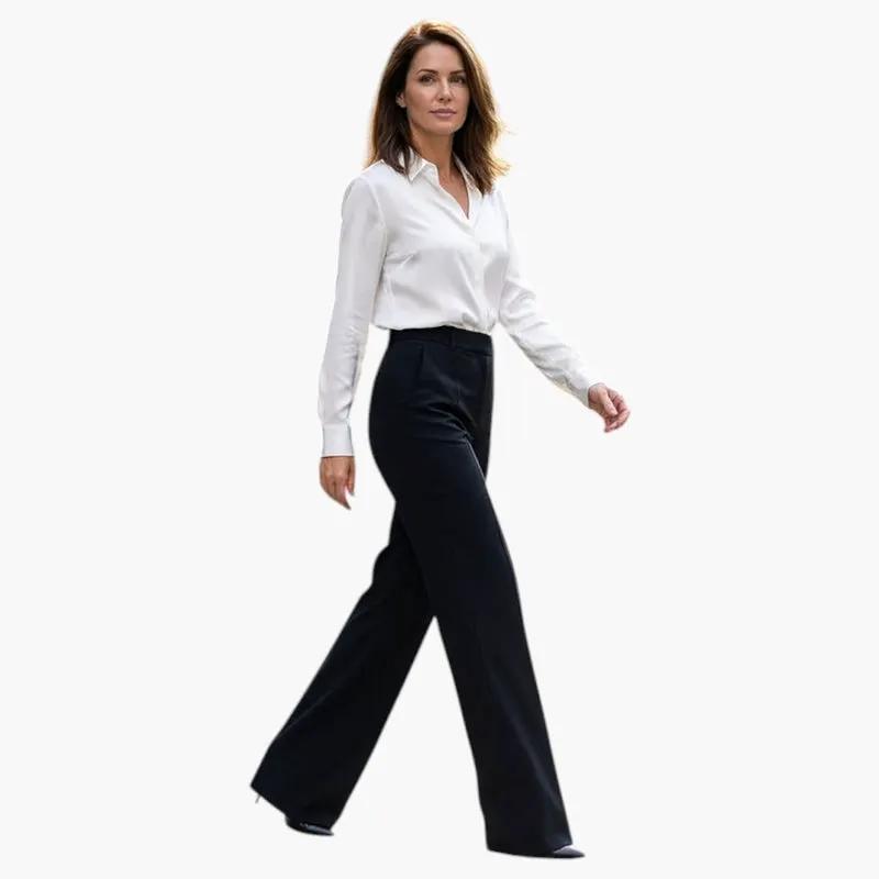 Kobieta w eleganckich czarnych spodniach z prostą nogawką i białą koszulą