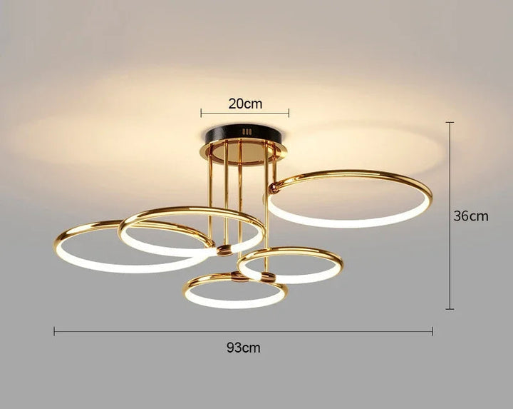 Złota lampa do salonu o unikalnym designie z geometrycznych okręgów LED