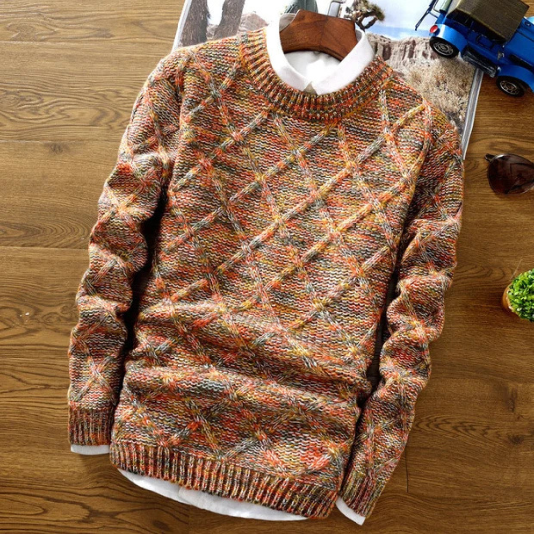 Męski sweter dzianinowy o unikalnym wzorze w odcieniach pomarańczu na drewnianym tle