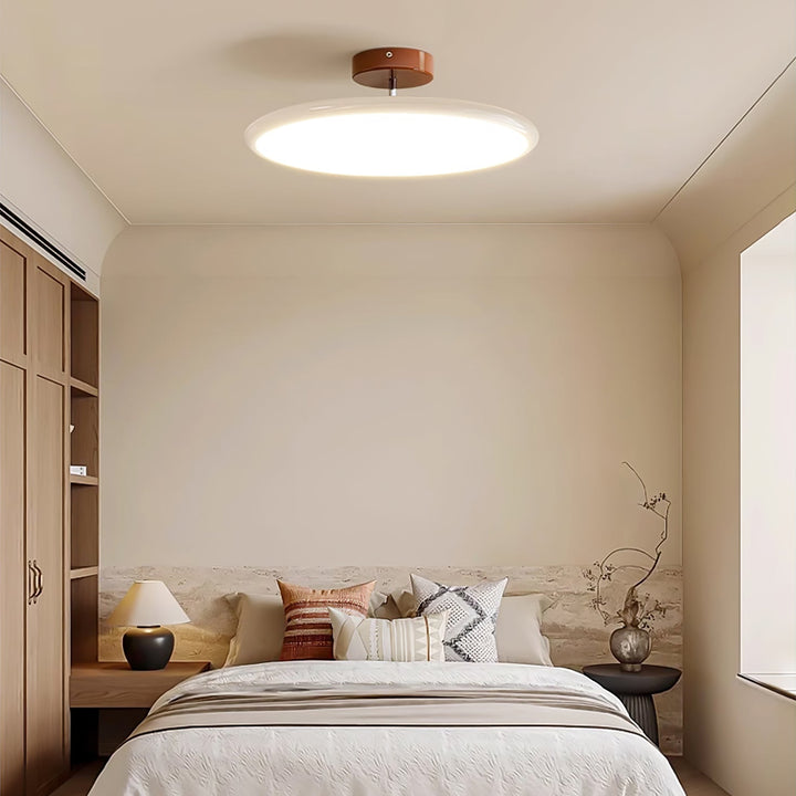 Zielona designerska lampa natynkowa LED, smukła i regulowana do salonu.