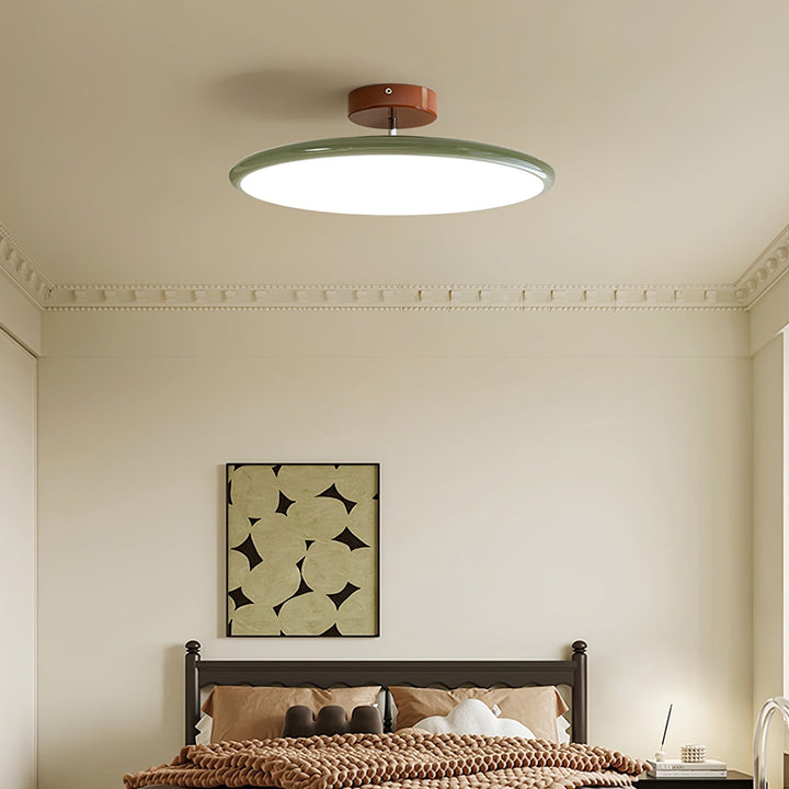 Zielona lampa LED okrągła, montaż natynkowy, do nowoczesnego korytarza.