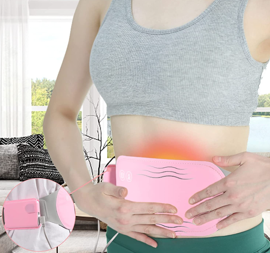 Bezprzewodowa poduszka grzewcza na brzuch z masażem wibracyjnym. Idealna na bóle menstruacyjne i relaks.