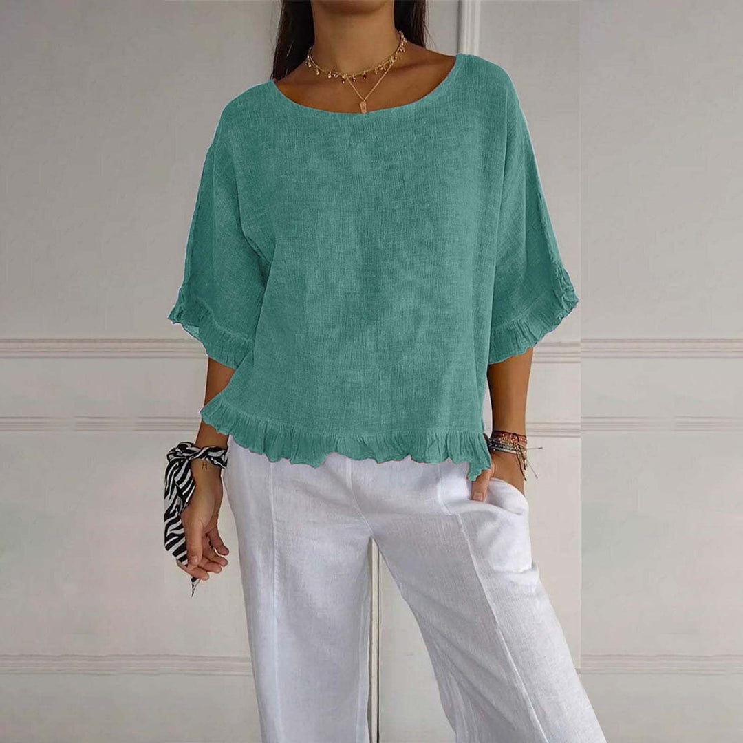 Uniwersalna bluzka damska z falbankami, luźny krój, elegancki top na lato.