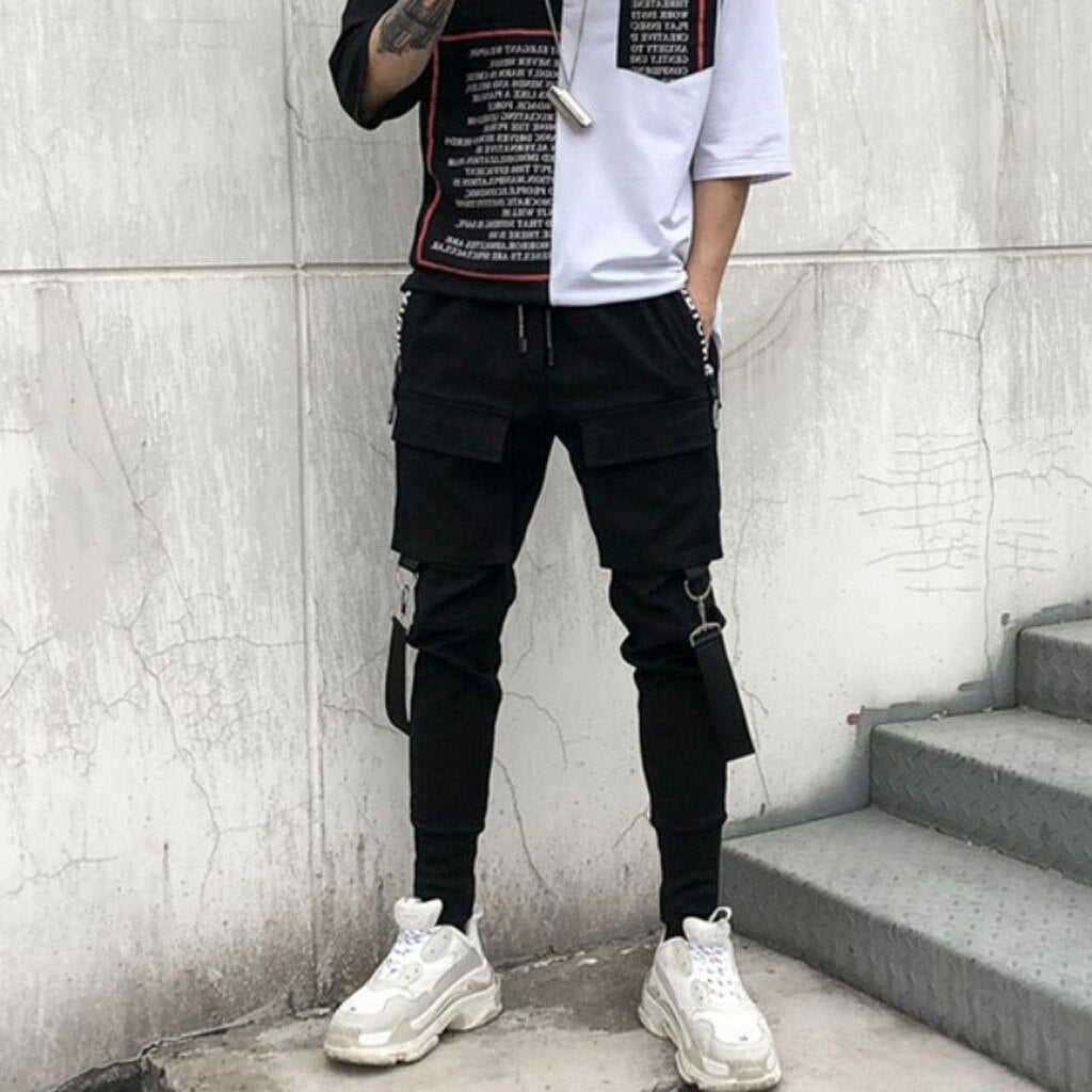 Bojówki męskie typu joggersy z funkcjonalnymi kieszeniami. Stylowe spodnie do streetwearu i casualowych looków.