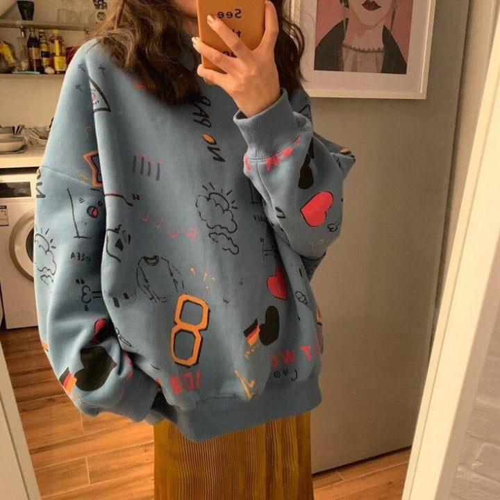Modna damska bluza z dzianiny dresowej z zabawnym nadrukiem. Krój oversize, idealna do casualowych stylizacji.