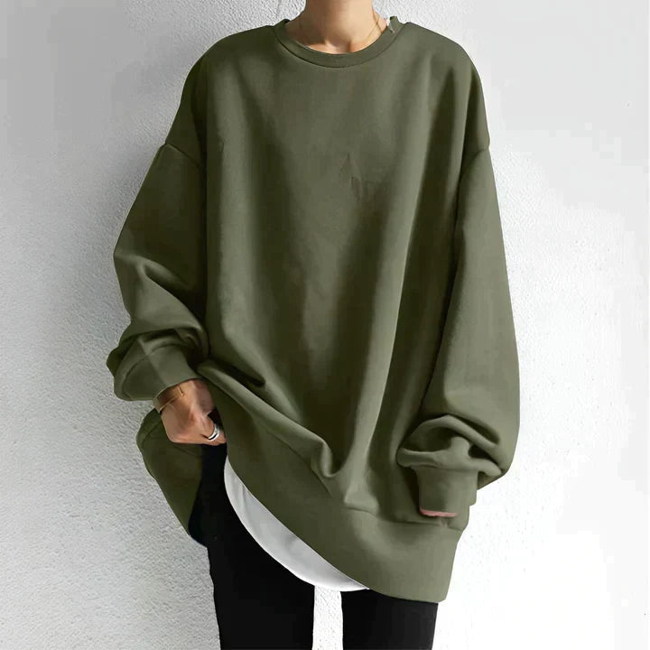 Wygodna bluza damska z okrągłym dekoltem, w modnym stylu oversize. Idealna na jesień i zimę.