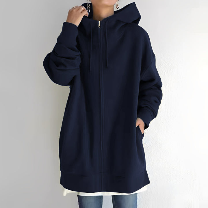 Zimowa bluza damska oversize z kapturem, zapewniająca komfort i swobodę ruchu.