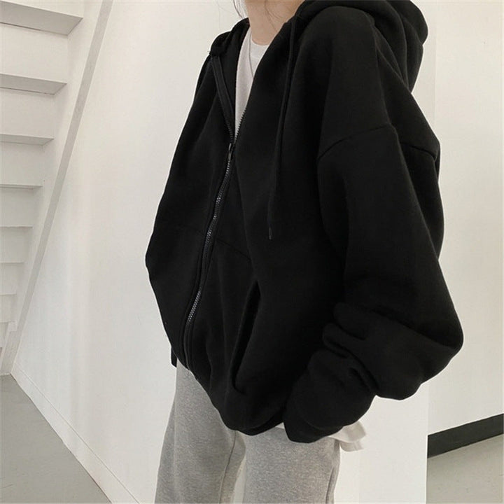 Modna bluza damska rozpinana z kapturem, luźny krój, styl casual. Idealna do codziennych outfitów.
