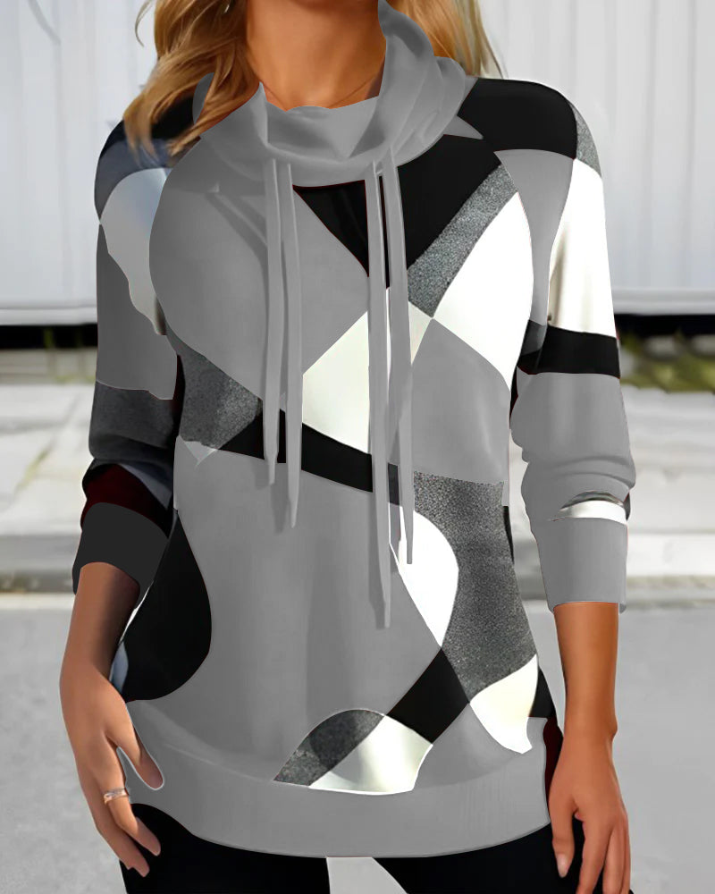 Modna damska bluza z kapturem i unikalnym geometrycznym wzorem. Stylowa odzież na jesień/zimę, do miejskich outfitów.