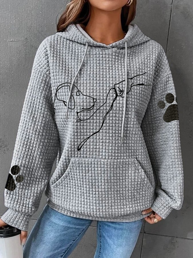 Wygodna bluza damska z kapturem, luźny krój, z uroczym nadrukiem psa. Modny element casualowej odzieży.