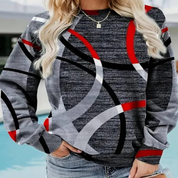Damska bluza zimowa z modnym wzorem denim. Ciepły sweter damski w luźnym kroju, do jesienno-zimowych stylizacji.