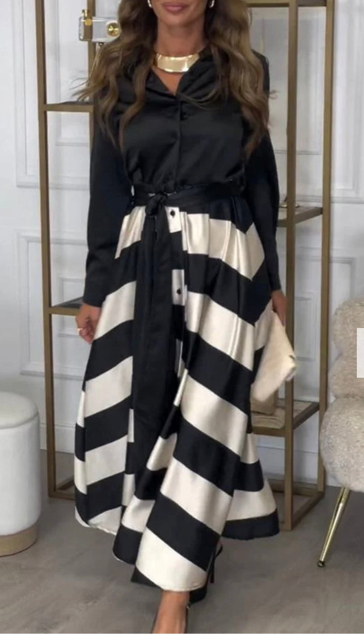 Modelka prezentuje elegancką dwuczęściową sukienkę maxi w paski, idealna na wyjście.