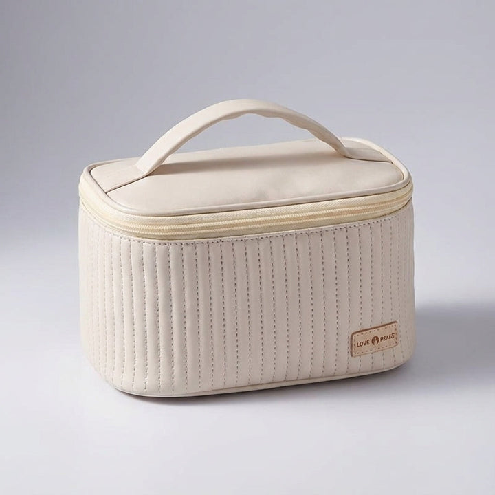 Elegancka damska kosmetyczka podróżna NeatCase z pikowaniem, funkcjonalna torba-organizer na kosmetyki do makijażu.