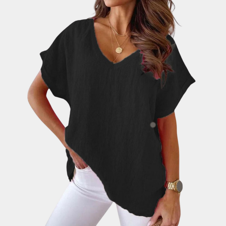 Casualowy t-shirt damski Lidia z dekoltem V. Komfortowa, luźna koszulka, idealna do codziennych stylizacji.