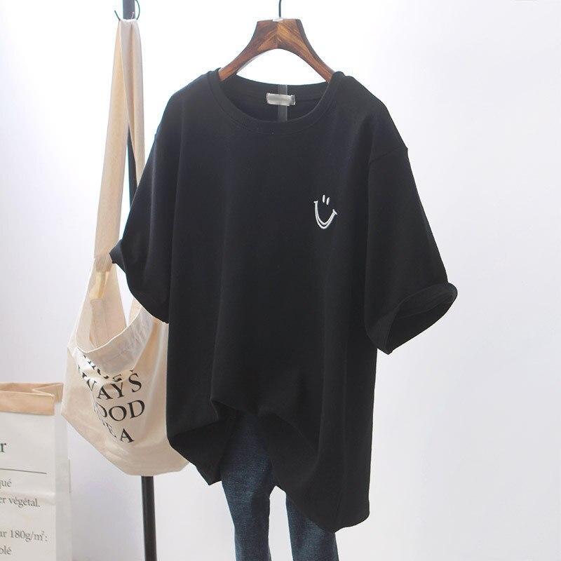 Czarna koszulka damska oversize, stylowy t-shirt z modnym nadrukiem uśmiechniętej buźki. Luźny krój.