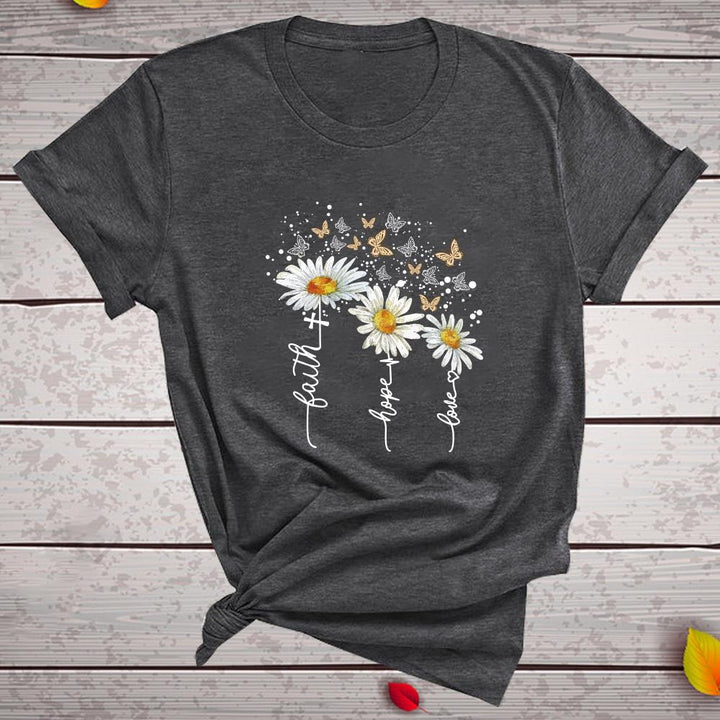 Elegancka i wygodna damska koszulka T-shirt z modnym kwiatowym wzorem. Doskonała na wiosnę i lato, moda casual.