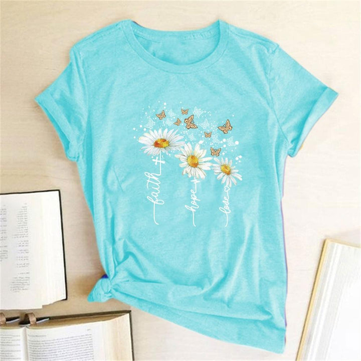 Uniwersalna damska koszulka T-shirt. Kwiatowy nadruk sprawia, że jest idealna do casualowych i eleganckich stylizacji.