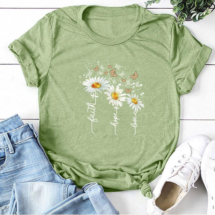 Wiosenna damska koszulka T-shirt z kolorowym kwiatowym wzorem. Idealna na ciepłe dni i letnie, casualowe stylizacje.