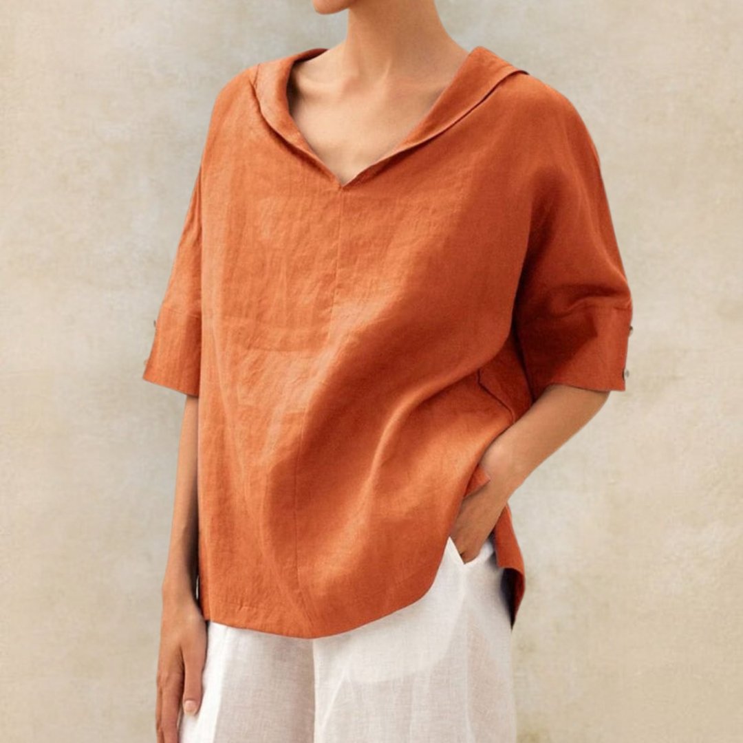 Modna damska bluzka oversize V-neck. Idealna na lato, codzienna i elegancka, z rękawem do łokcia.