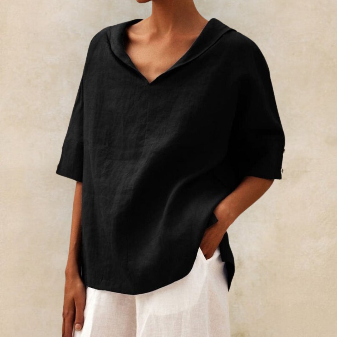 Damska bluzka V-neck oversize z rękawem na guzik. Elegancka i wygodna, doskonała na lato i do pracy.