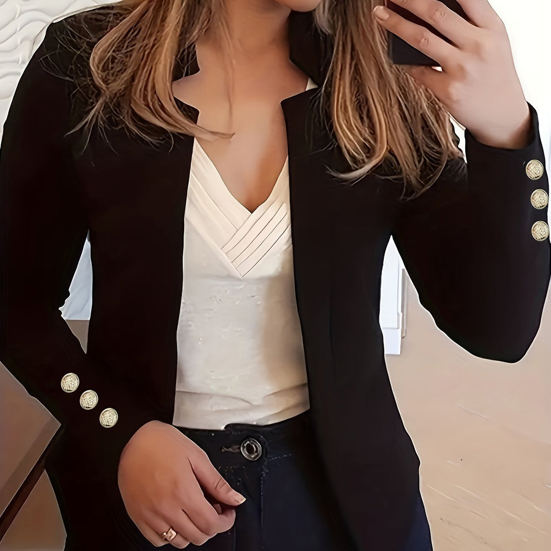 Czarny żakiet damski, długi rękaw, otwarty fason, styl smart casual.