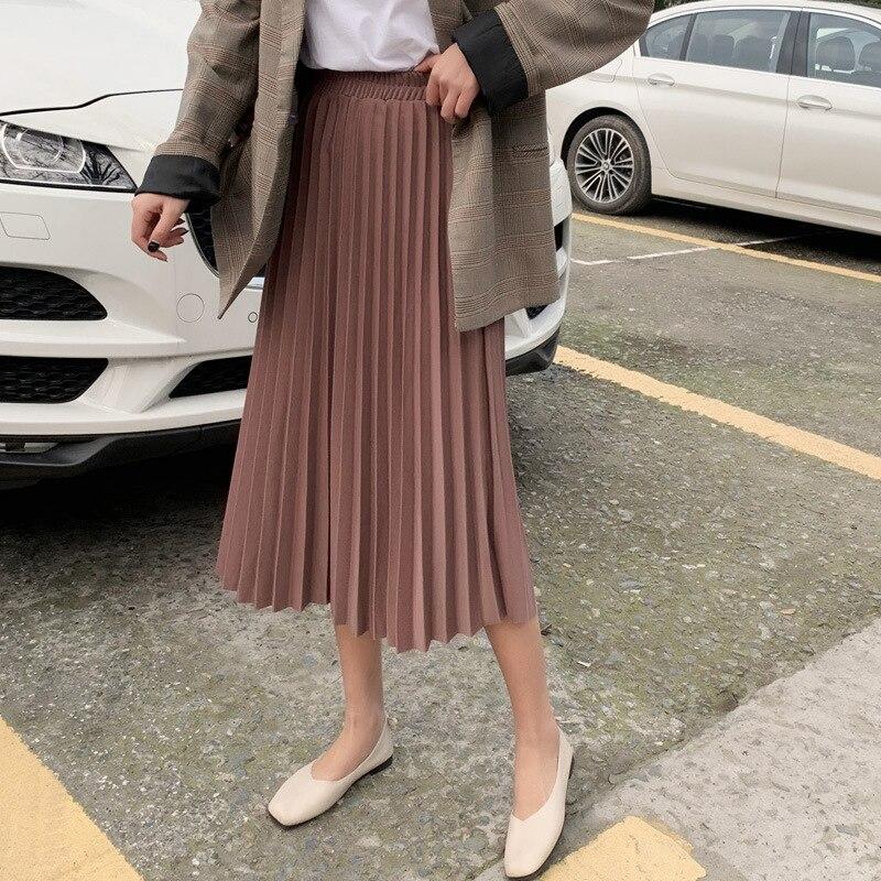Modna plisowana spódnica midi damska. Rozkloszowany krój z drobnymi plisami i wygodną gumką. Styl casual/formalny.