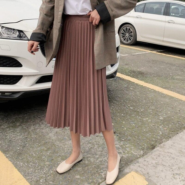 Modna plisowana spódnica midi damska. Rozkloszowany krój z drobnymi plisami i wygodną gumką. Styl casual/formalny.