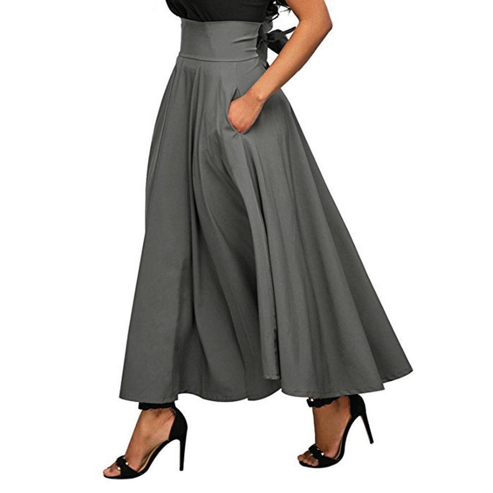 Elegancka spódnica damska maxi, rozkloszowana, z praktycznymi kieszeniami i kokardą. Styl casual i formalny.