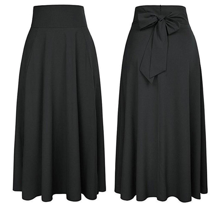 Spódnica damska maxi rozkloszowana, z wygodnymi kieszeniami i modną kokardą. Casualowy, elegancki look.