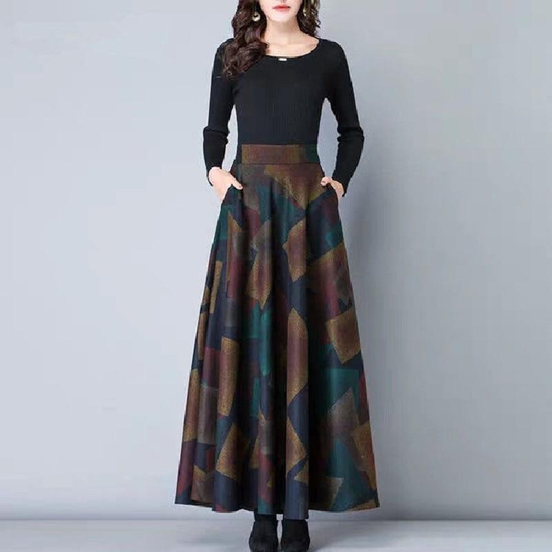 Elegancka spódnica maxi damska w stylu retro, z barwnym kwiatowym wzorem i praktycznymi kieszeniami.