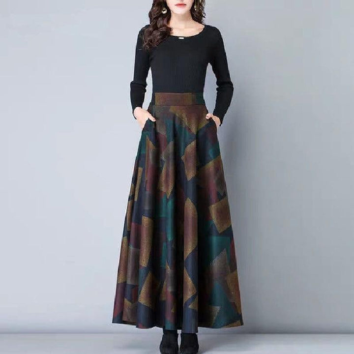 Elegancka spódnica maxi damska w stylu retro, z barwnym kwiatowym wzorem i praktycznymi kieszeniami.